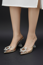 Model legs wearing crystal brooch heels - centered