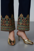 Model legs wearing golden party peep heels